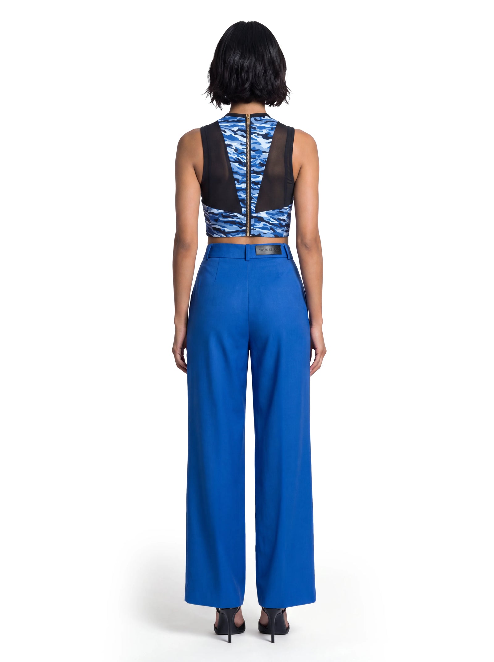 Blaue Luxus Designer Anzugshose für Damen aus Wolle mit weiter Beinform, klarer Linienführung und elegantem Tailoring in der Rückansicht.