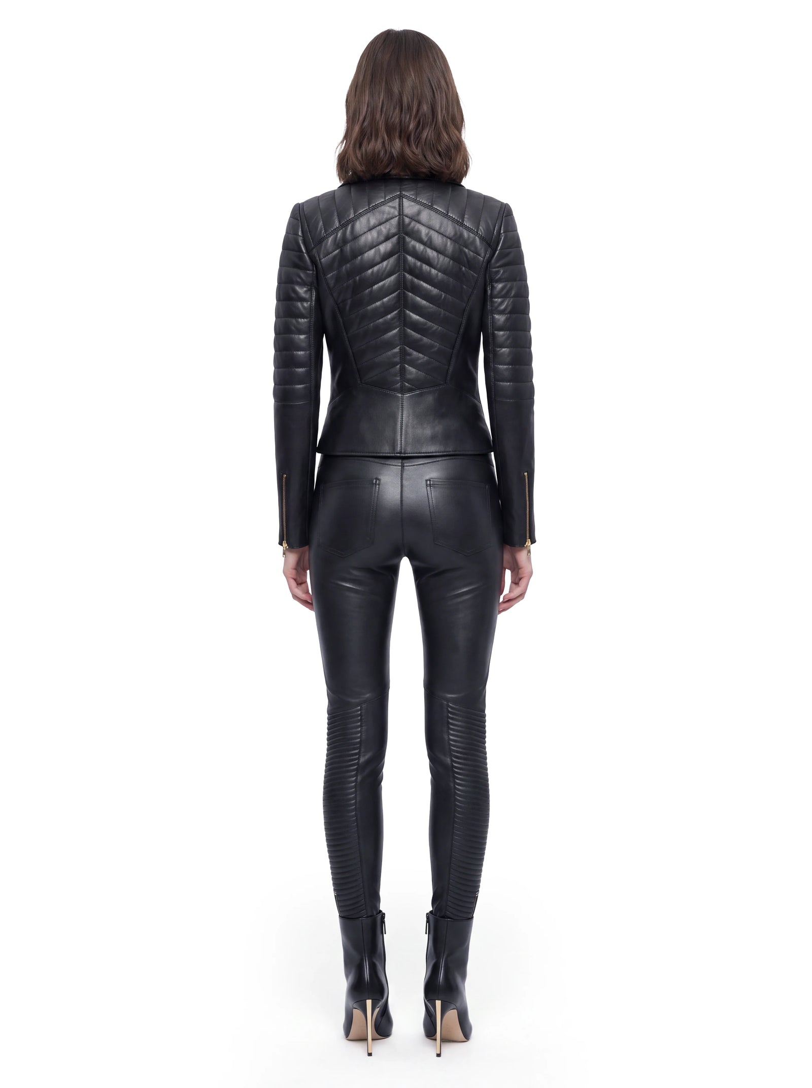 Schwarze Luxus Designer Lederjacke mit aufwendig gestepptem Rückendesign, figurbetonter Silhouette und markanten Steppdetails an den Ärmeln für einen modernen Biker-Look.