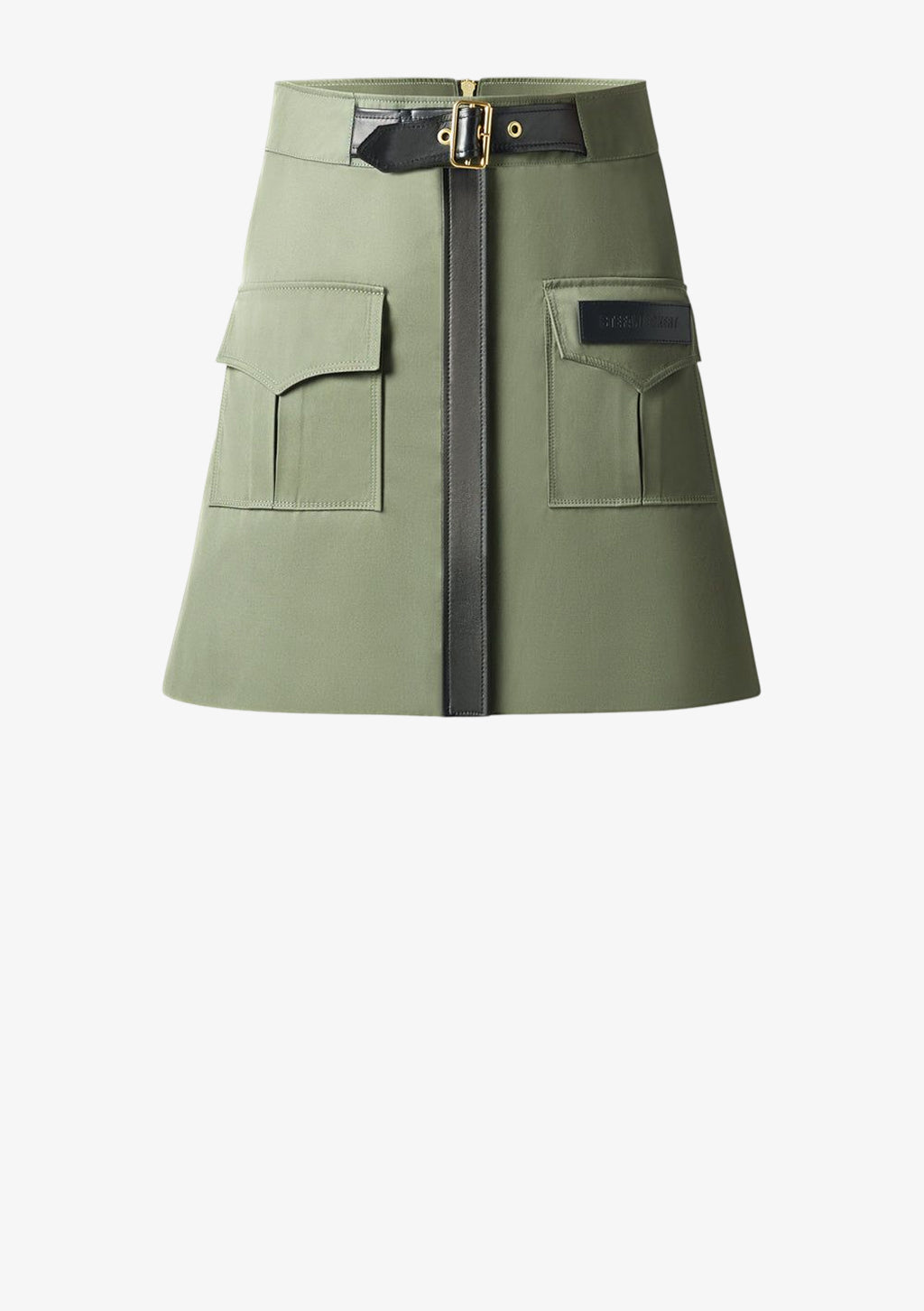 Safari Minirock mit Lederapplikationen in khaki von Designer Stefan Eckert. Erhältlich in Hamburg, London, New York, London und Paris. Skirt with leather applications in khaki by designer Stefan Eckert. Available in Hamburg, London, New York, London and Paris.